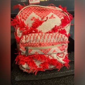 Coral Pink Shag Yarn Mini Backpack with Zip Around plus front zipper
Compartment